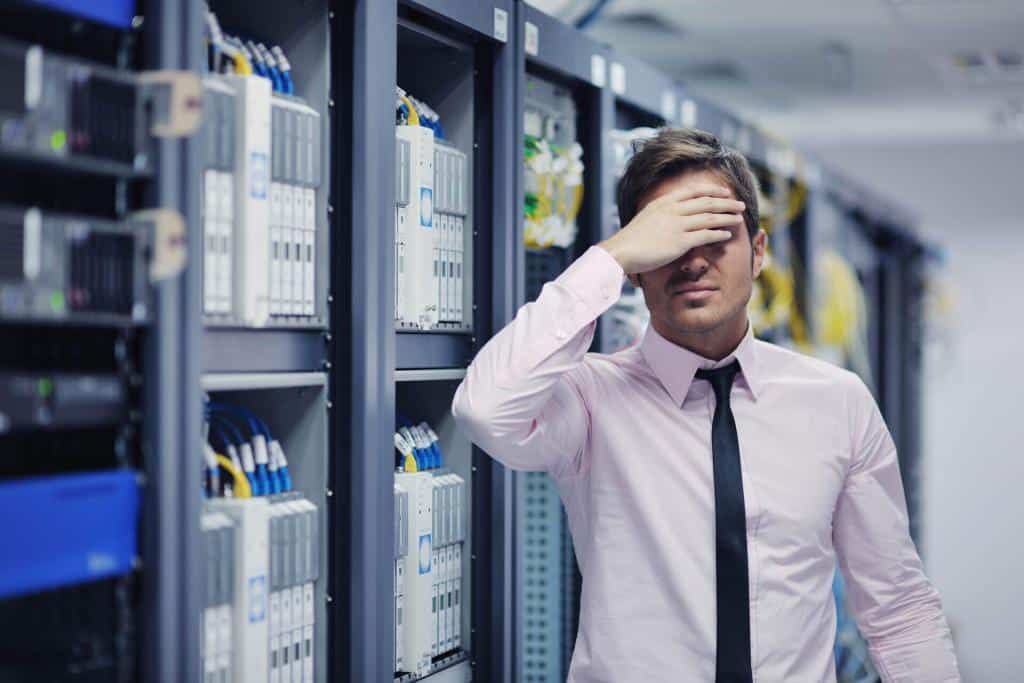 IT technician monitoring systems to reduce downtime through proactive alerts.